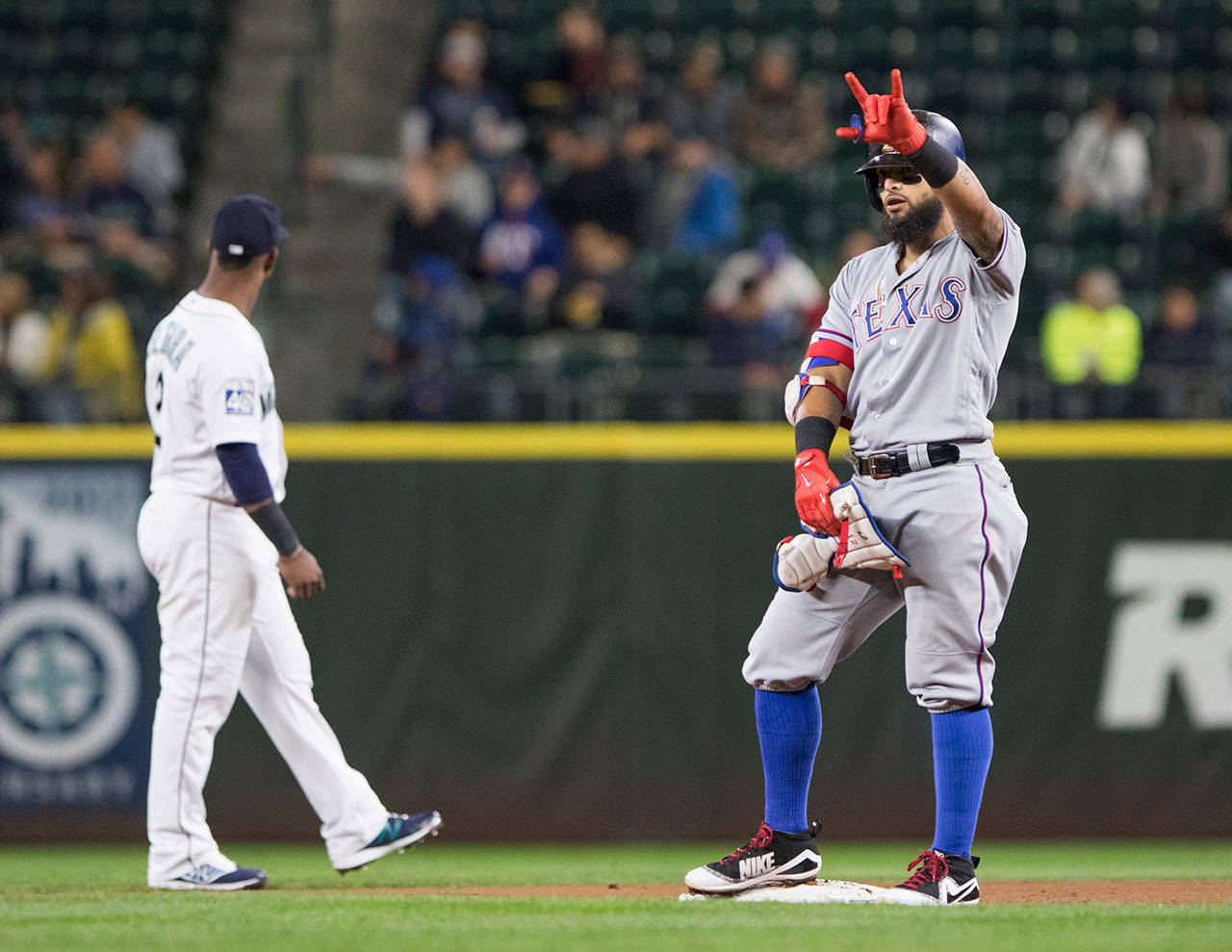 The Rangers’ Rougned Odor celebrates a ground rule double in the fifth inning of a game against the Mariners on Sept. 19, 2017, in Seattle. (AP Photo/Lindsey Wasson)