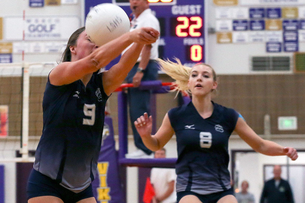 Glacier Peak’s Cierra Pratt (left) chases down the ball with teammate Carlee Bond trailing during a match against Lake Stevens on Sept. 20, 2017, at Lake Stevens High School. Lake Stevens defeated Glacier Peak 3-0. (Kevin Clark / The Herald)

