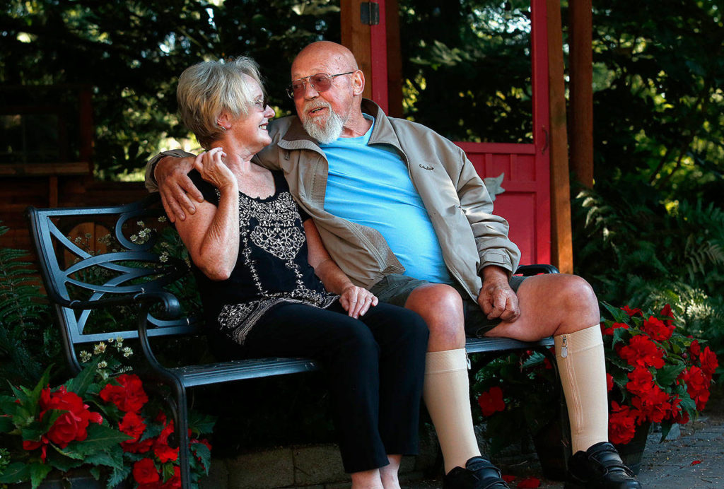 One month ago on Aug. 22, Jim Mathis and his wife, Susan Hansberry, sat on a bench in the garden they created, enjoying a fine summer day and each other, despite Jim’s health difficulties. (Dan Bates / The Herald)
