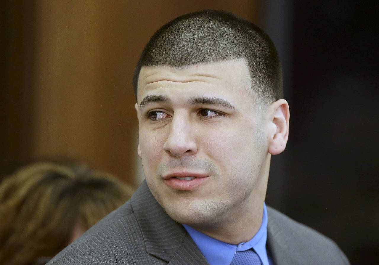 In this April 14 photo, former New England Patriots tight end Aaron Hernandez reacts to his double murder acquittal after the sixth day of jury deliberations at Suffolk Superior Court in Boston. (AP Photo/Stephan Savoia, Pool, File)