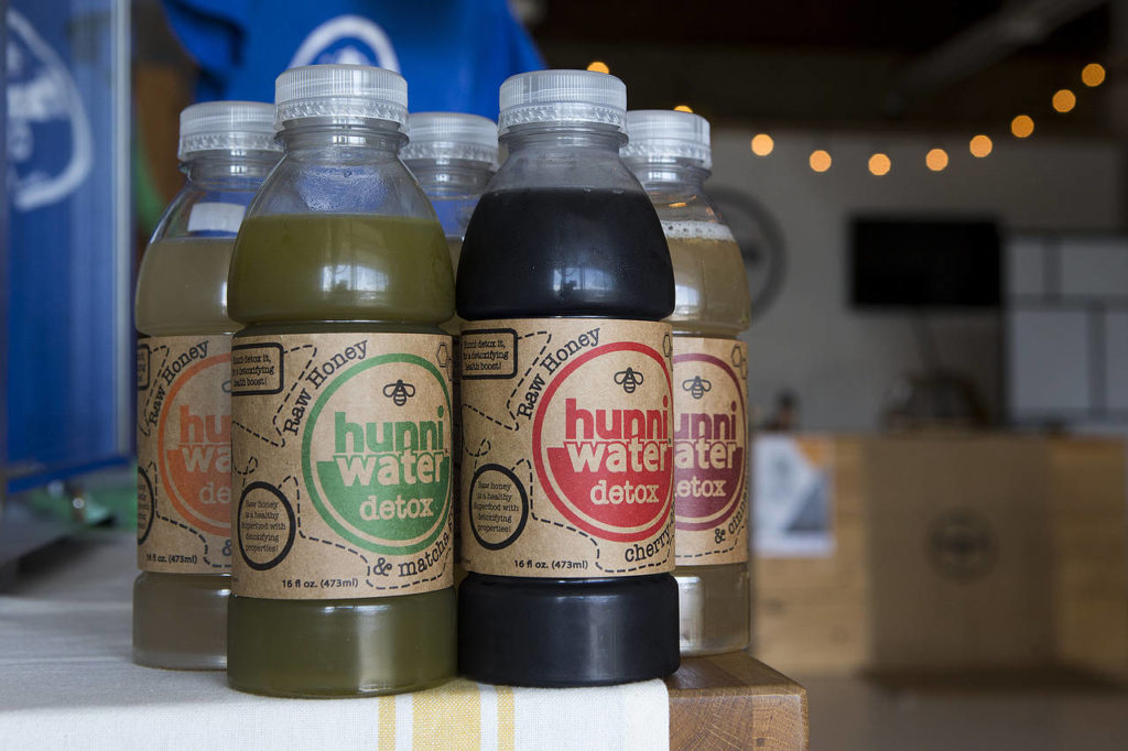 Along with traditional honey products, Hunni Company also produces Hunniwater which sells at various grocery stores including QFC, Safeway and PCC Natural Markets. (Ian Terry / The Herald)

