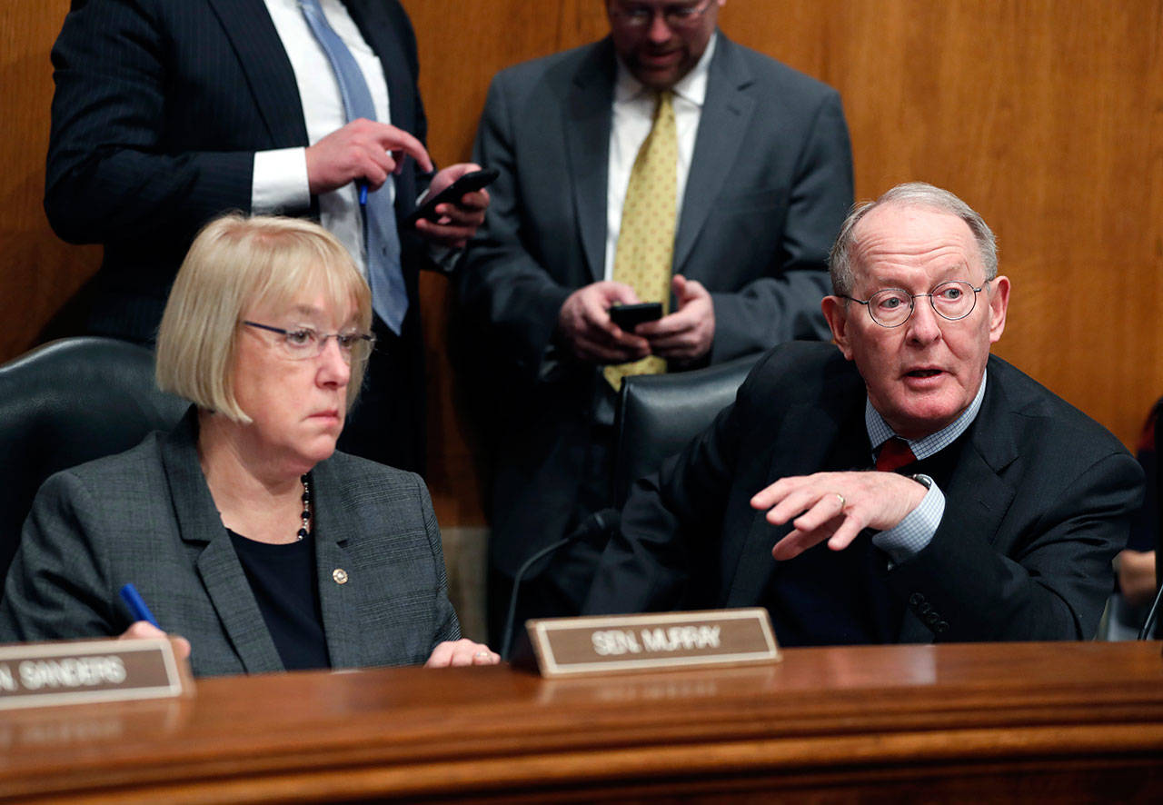 Senate Health, Education, Labor and Pensions Committee Chairman Sen. Lamar Alexander, R-Tennessee, accompanied by the committee’s ranking member Sen. Patty Murray, D-Washington, speaks on Capitol Hill in Washington in January. (Alex Brandon/Associated Press file photo)