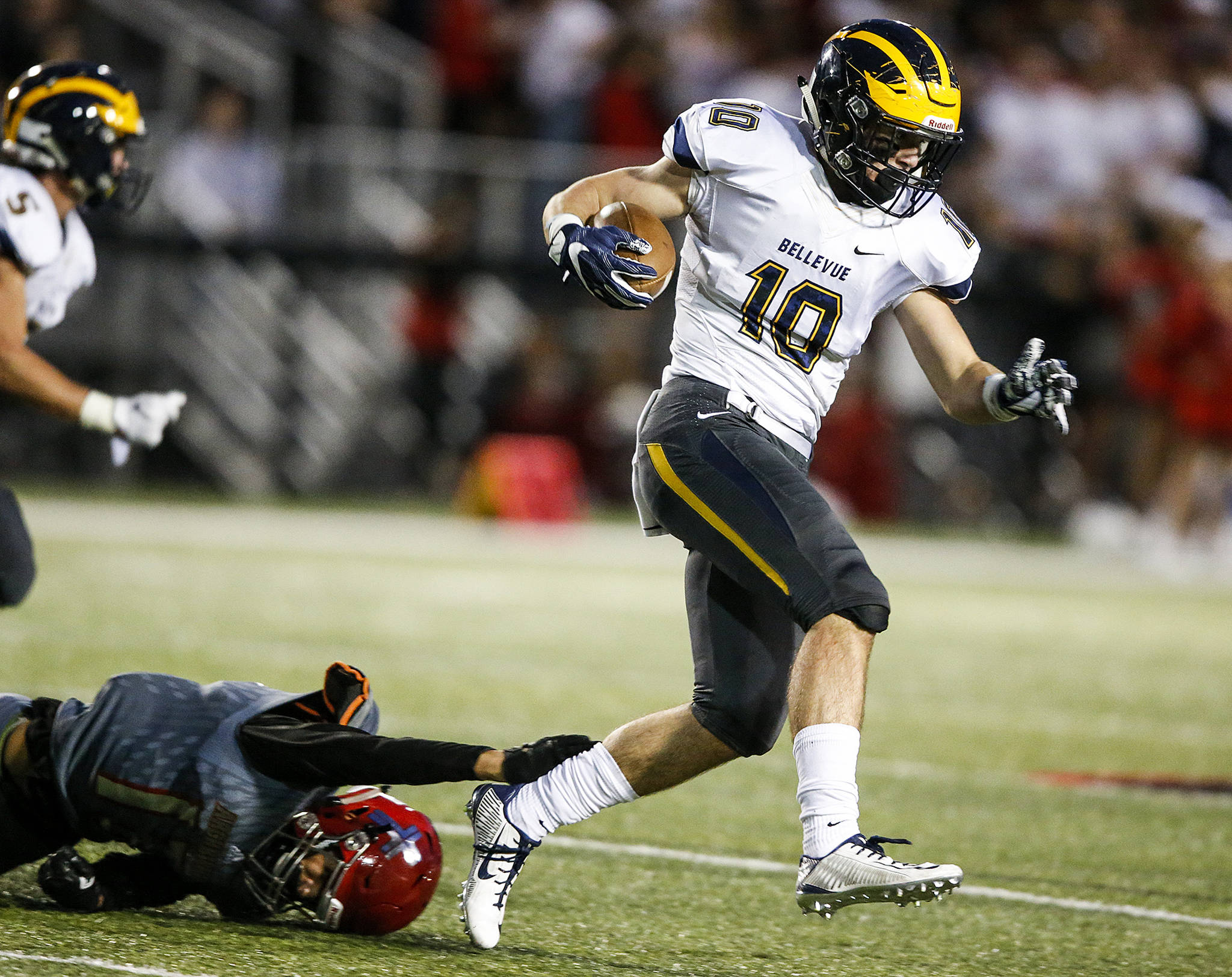 Bellevue’s Drew Fowler (right) runs through Archbishop Murphy defender Dillon Halpin during a game at Archbishop Murphy High School in Everett on Sept. 22, 2017. (Ian Terry / The Herald)