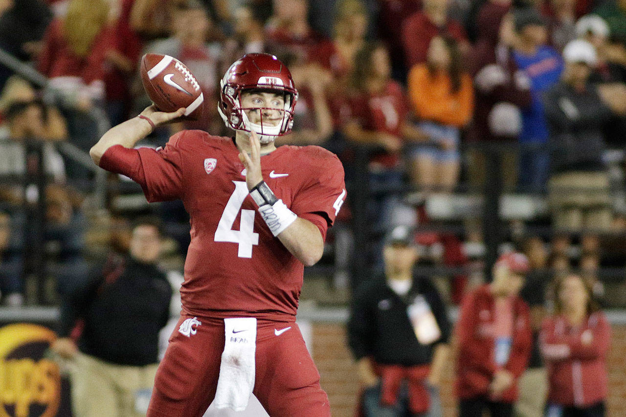 Washington State quarterback Luke Falk (4) throws a pass during the second half of a game against Boise State on Sept. 9, 2017, in Pullman. (AP Photo/Young Kwak)