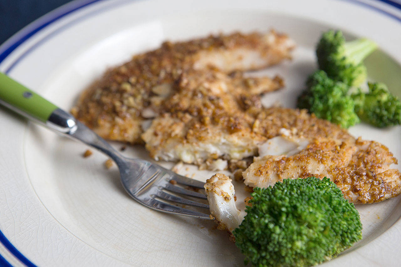 Pecan crusted tilapia is a fish dish that can turn around a seafood skeptic or picky eater. (Photo by Jennifer Chase for The Washington Post)