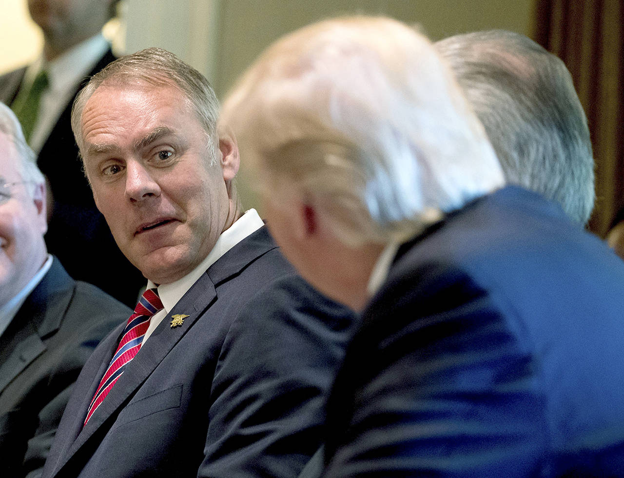 In this June 12 photo, Interior Secretary Ryan Zinke listens as President Donald Trump speaks during a Cabinet meeting in the Cabinet Room of the White House in Washington. (AP Photo/Andrew Harnik, File)