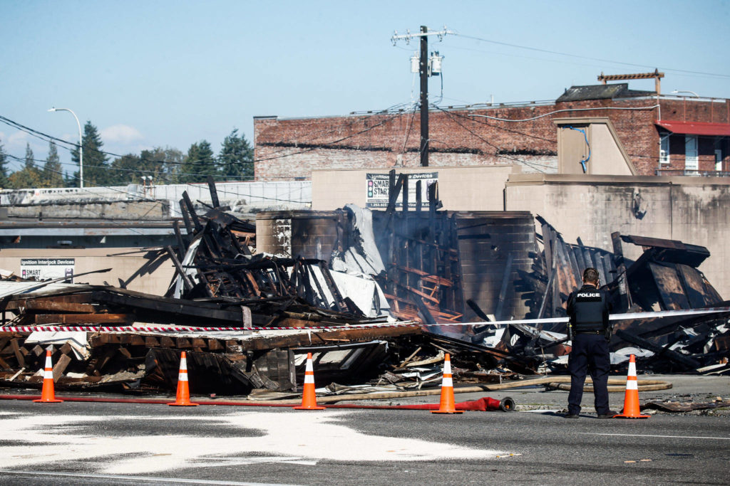 Burnt debris from Everett Office Furniture, on Broadway in Everett, is seen on Tuesday, Sept. 26. (Ian Terry / The Herald)
