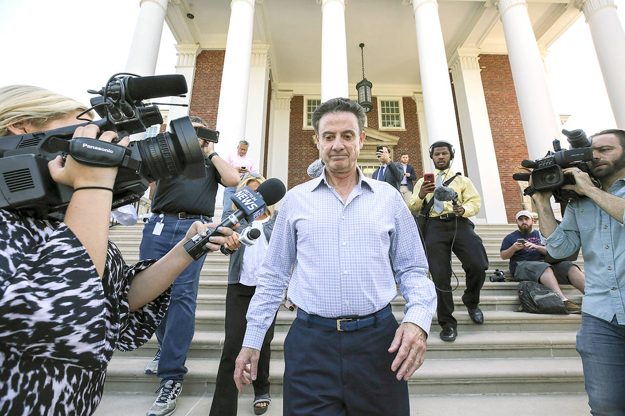 Louisville men’s basketball coach Rick Pitino leaves Grawemeyer Hall after having a meeting with the university’s interim president, Greg Postel, on Wednesday in Louisville, Kentucky. (Michael Clevenger/The Courier-Journal via AP)
