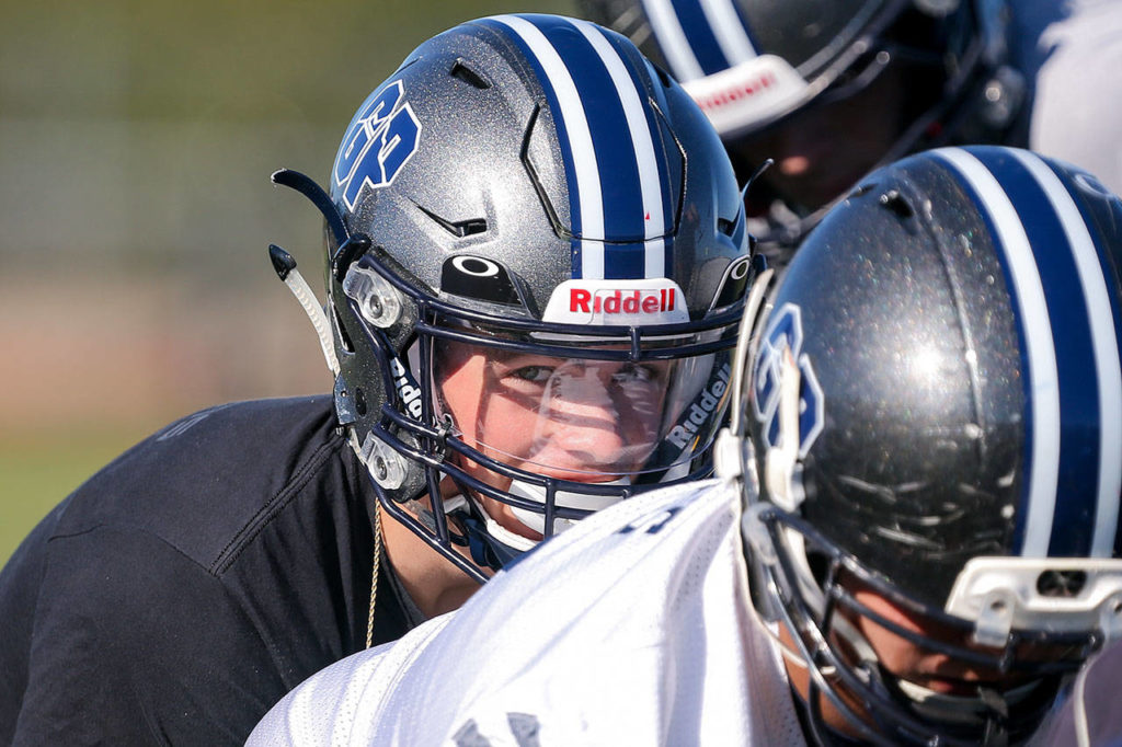 Glacier Peak quarterback Ayden Ziomas lines up behind center during practice Sept. 27, 2017, at Glacier Peak High School in Snohomish. (Kevin Clark / The Herald)
