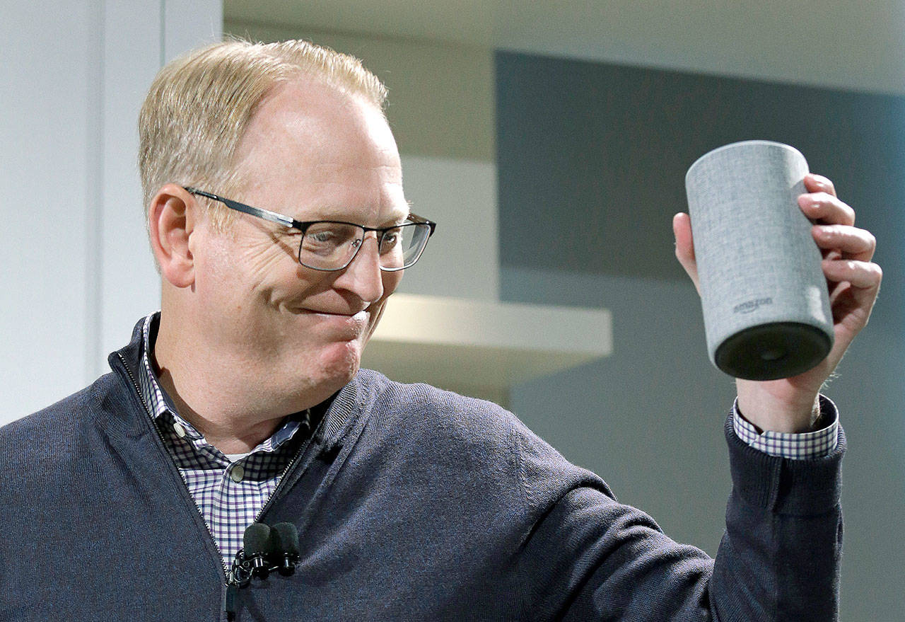 David Limp, senior vice president of Devices and Services at Amazon, smiles as he displays a new Amazon Echo during an event announcing several new Amazon products by the company Wednesday in Seattle. (AP Photo/Elaine Thompson)