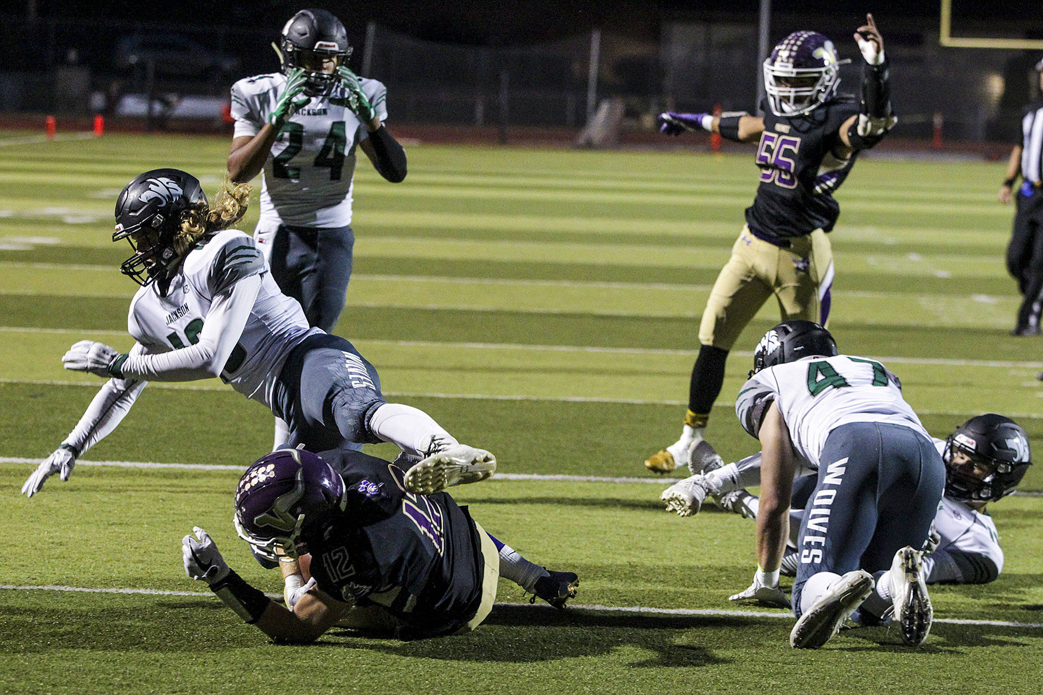 Lake Stevens’ Austin Murren (lower left) dives into the end zone for a touchdown in the first quarter of a game against Jackson on Sept. 29, 2017, at Lake Stevens High School. (Ian Terry / The Herald)
