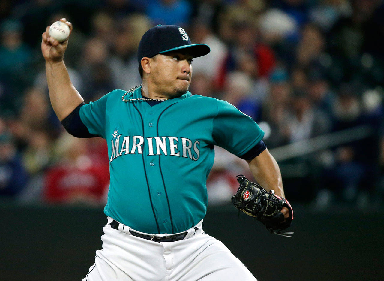 Mariners starting pitcher Erasmo Ramirez throws to an Indians batter during the first inning of a game Sept. 22, 2017, in Seattle. (AP Photo/Ted S. Warren)