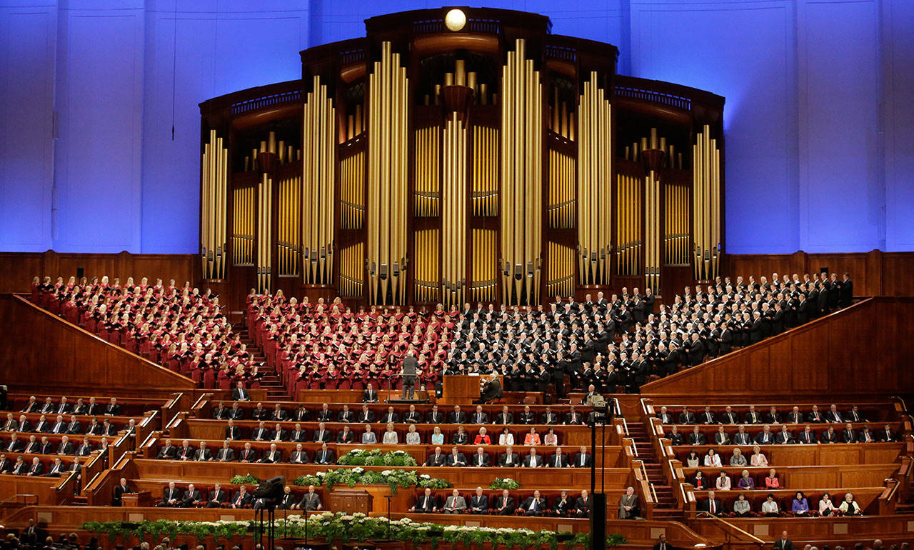 In this April 1, 2017, file photo, the Mormon Tabernacle Choir of The Church of Jesus Christ of Latter-day Saints perform in the Conference Center at the morning session of the two-day Mormon church conference in Salt Lake City. (AP Photo/Rick Bowmer, File)