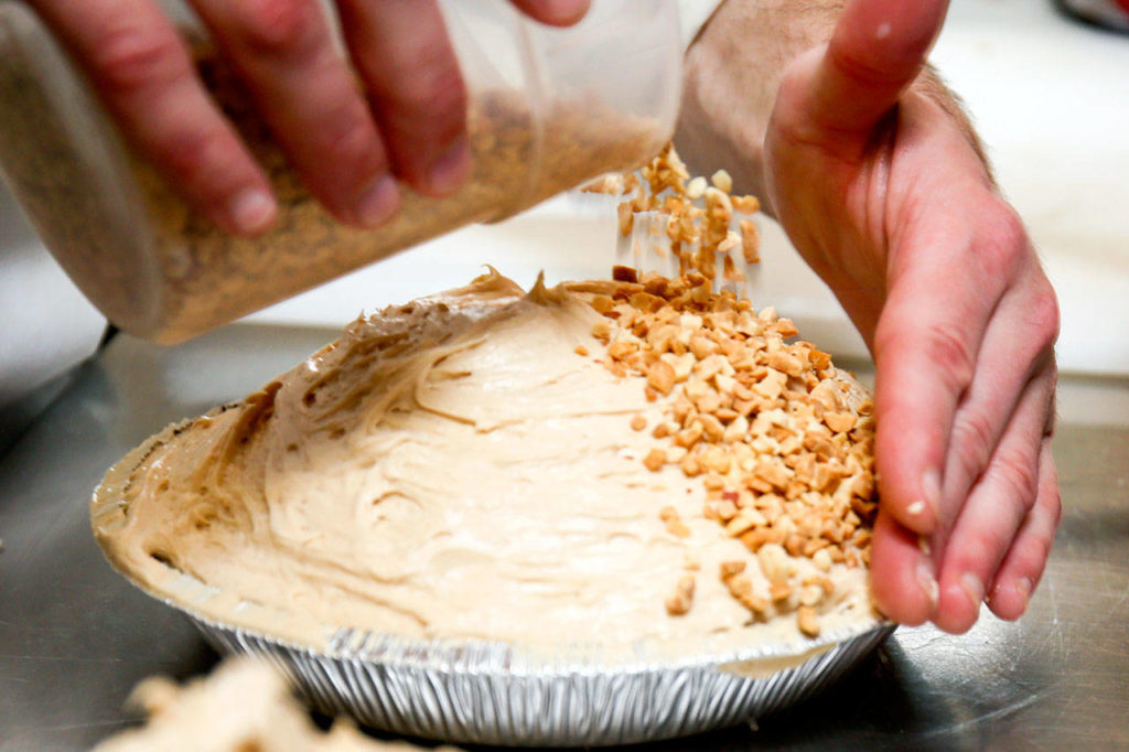Peanuts are sprinkled atop Buck’s peanut butter pie at Buck’s Cafe in Everett. (Kevin Clark / The Herald)

