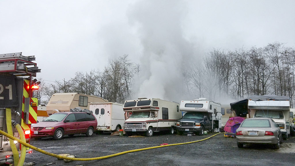 Officials investigated this makeshift trailer park on an industrial lot after a camper caught fire near Lynnwood last year. (Rikki King / The Herald)
