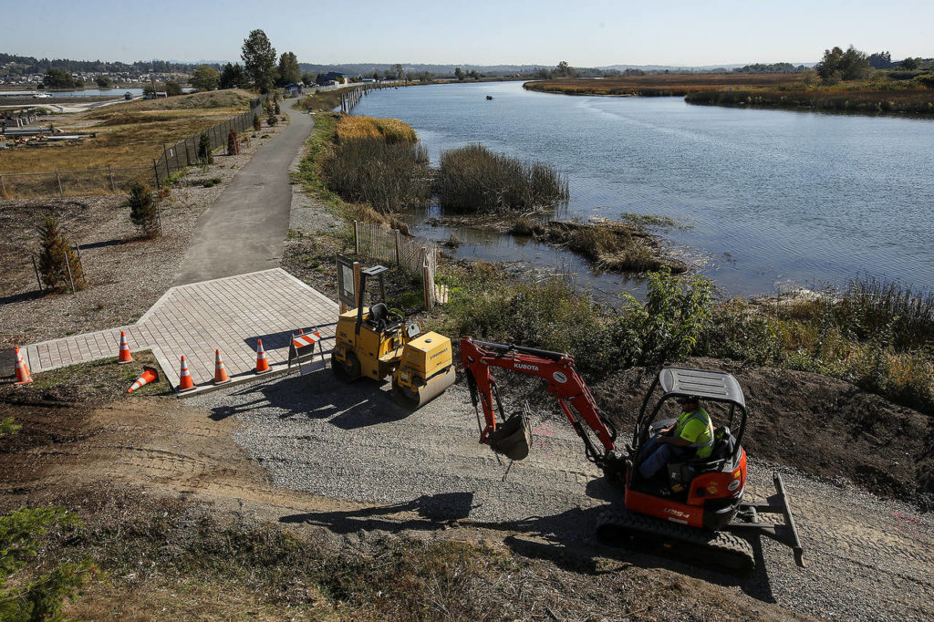 Work continues on the Ebey Waterfront Trail, which will eventually connect to parking by going underneath the bridge on Highway 529 heading into Marysville. (Ian Terry / The Herald)
