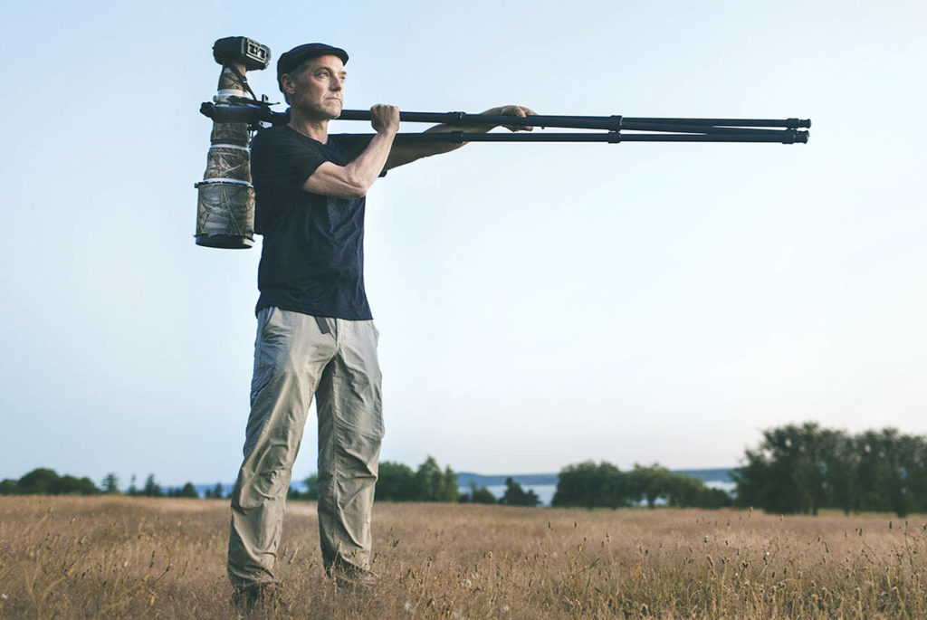 Paul Bannick looks out at the setting sun in Seattle’s Discovery Park, which was once an Army base where his father was decommissioned from World War II. (Photo: Quinn Russell Brown / Columns Magazine)
