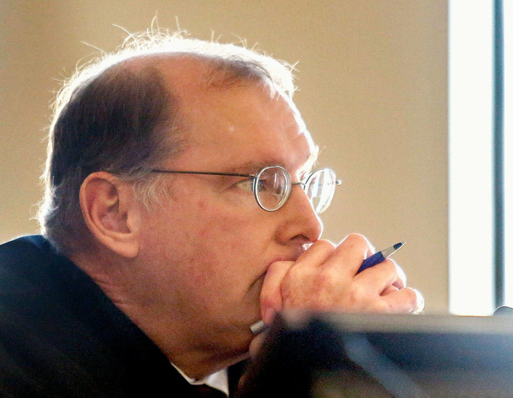 Before sentencing Amy Brown for attempted first-degree murder Tuesday, Superior Court Judge Michael Downes listens to her mother speak on her behalf. (Dan Bates / The Herald)
