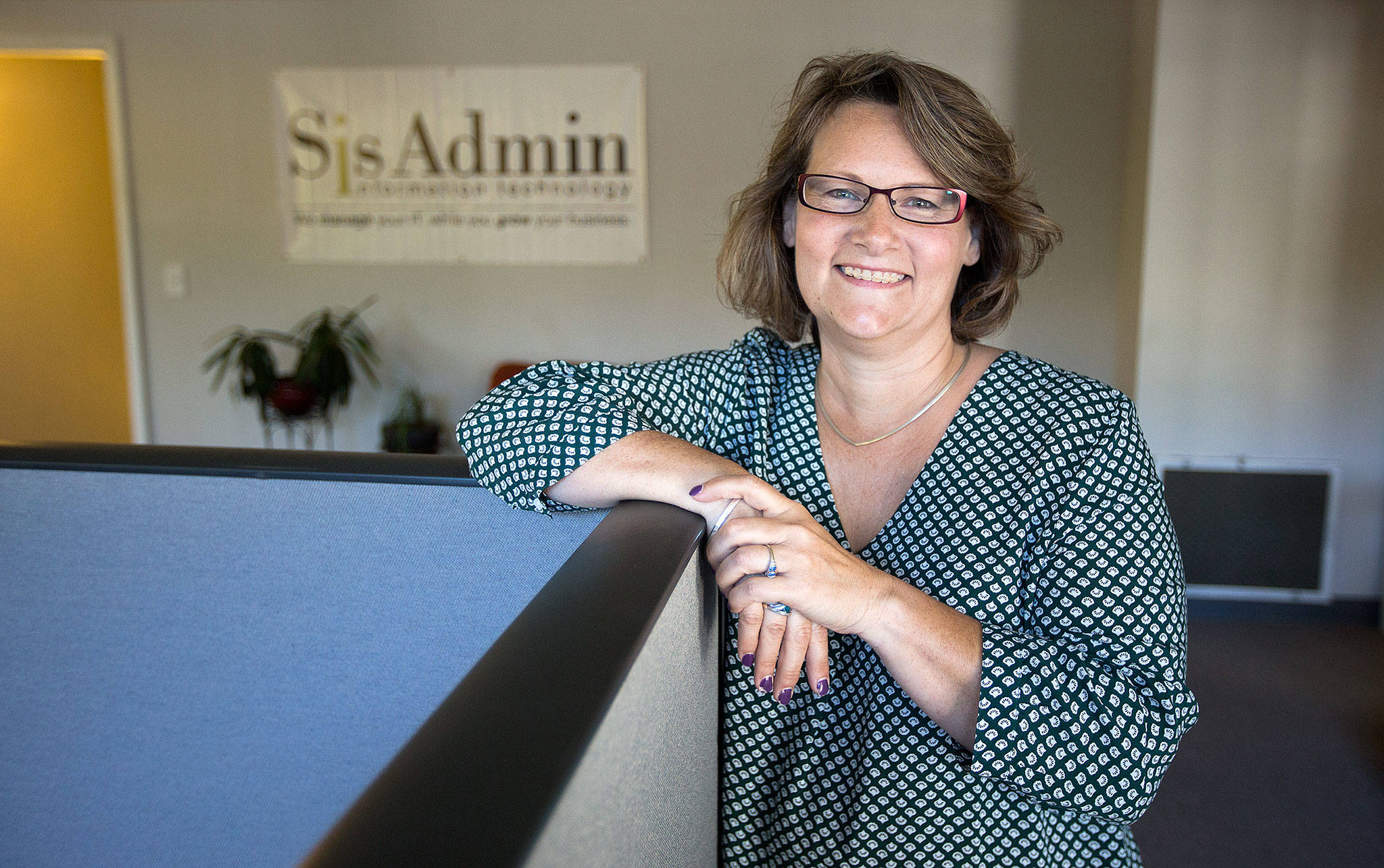 Mary Burris, founder of SisAdmin, stands in the new location on Cedar Avenue in Snohomish. The company provides IT support to small- and medium-sized businesses ranging from accounting firms to construction companies. (Andy Bronson / The Herald)