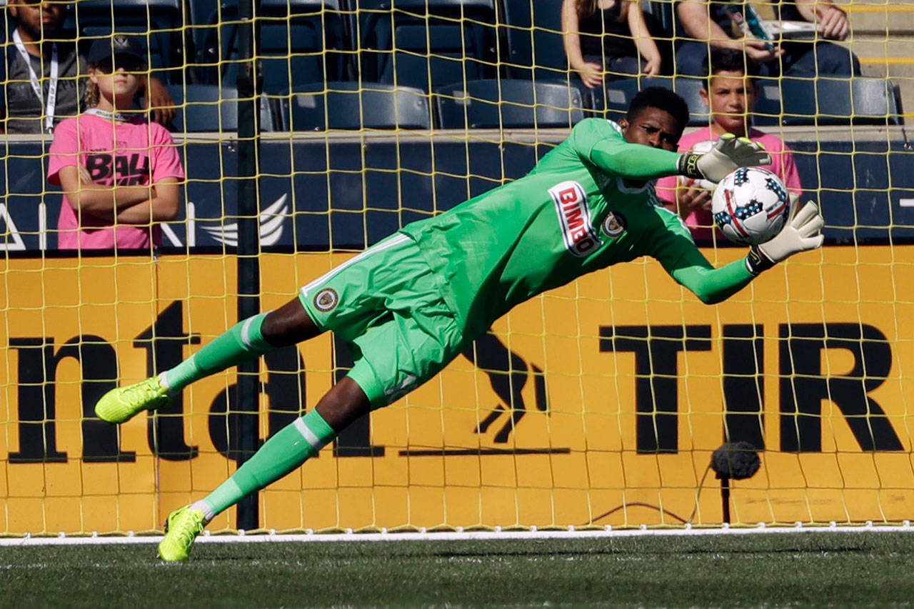 Philadelphia Union’s Andre Blake blocks a shot during the second half of an MLS soccer match against the Seattle Sounders on Sunday in Chester, Pennsylvania. (AP Photo/Matt Slocum)