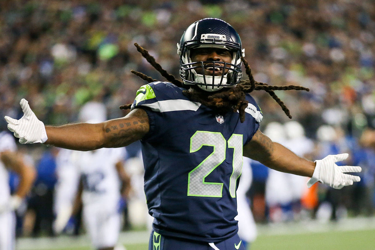 Seahawks running back J.D. McKissic celebrates a touchdown Sunday night at CenturyLink Field in Seattle. (Kevin Clark / The Herald)