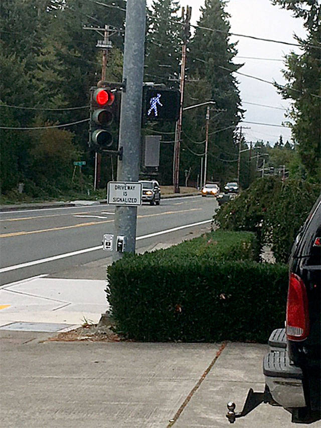 Two homes along busy 35th Avenue at 116th Street have a signal to help them get into and out of their driveways. Not all drivers see the small signs, and sometimes that leads to unexpected “visitors” who think they are turning onto a road. (Contributed photo)