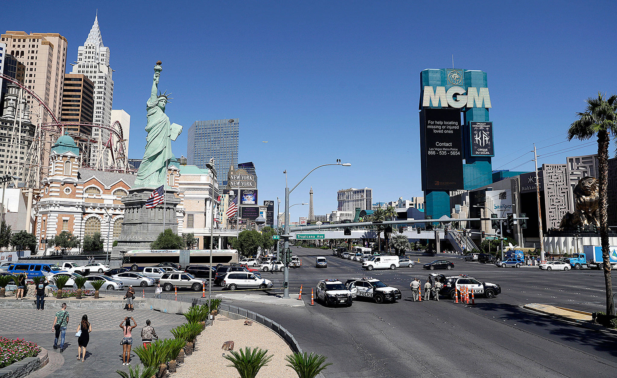 Police on Monday block access to part of the Las Vegas Strip near the scene of a mass shooting at Sunday’s music festival. (AP Photo/Marcio Jose Sanchez)