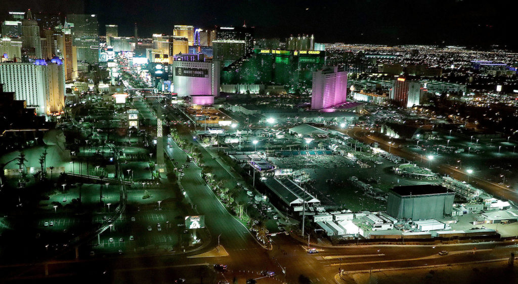 A nighttime view of the scene of the mass shooting (at right) on the Las Vegas Strip late Monday in Las Vegas. (AP Photo/Marcio Jose Sanchez)
