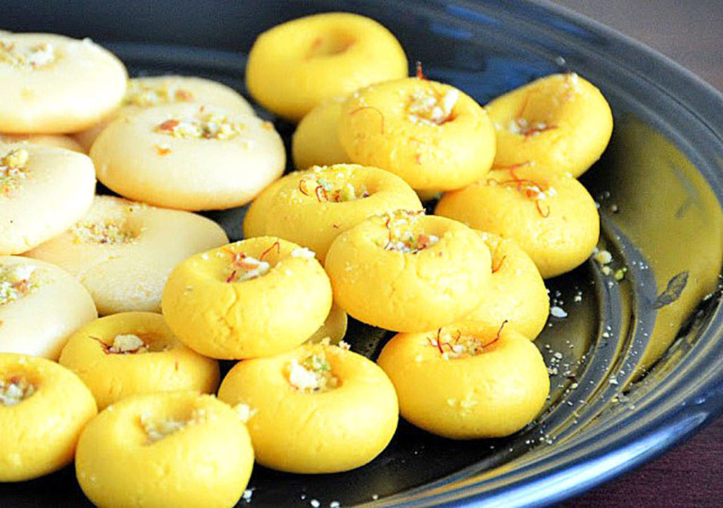 Pedhas are Indian ball-shaped sweets made with milk, milk powder, butter and sugar, plus traditional flavorings like cardamom, pistachio and saffron. (Reshma Seetharam/For The Herald)
