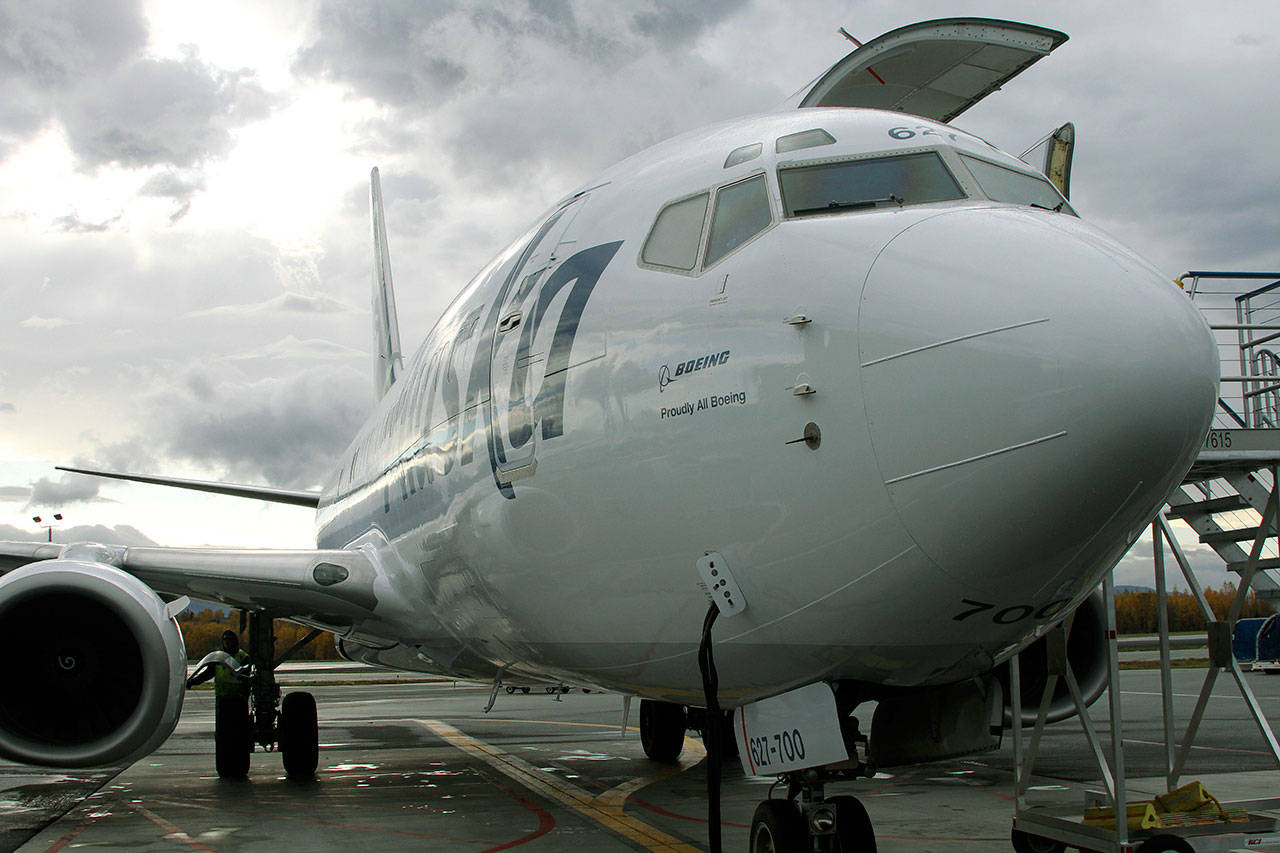 Alaska Airlines unveils the first passenger plane to be converted to a cargo jet Monday in Anchorage, Alaska. The 737-700s will increase cargo capacity by 20 percent in Alaska, and spell the end of the airline’s unique combi planes, which are 737-400 planes configured to be half-passenger, half-cargo. (AP Photo/Mark Thiessen)