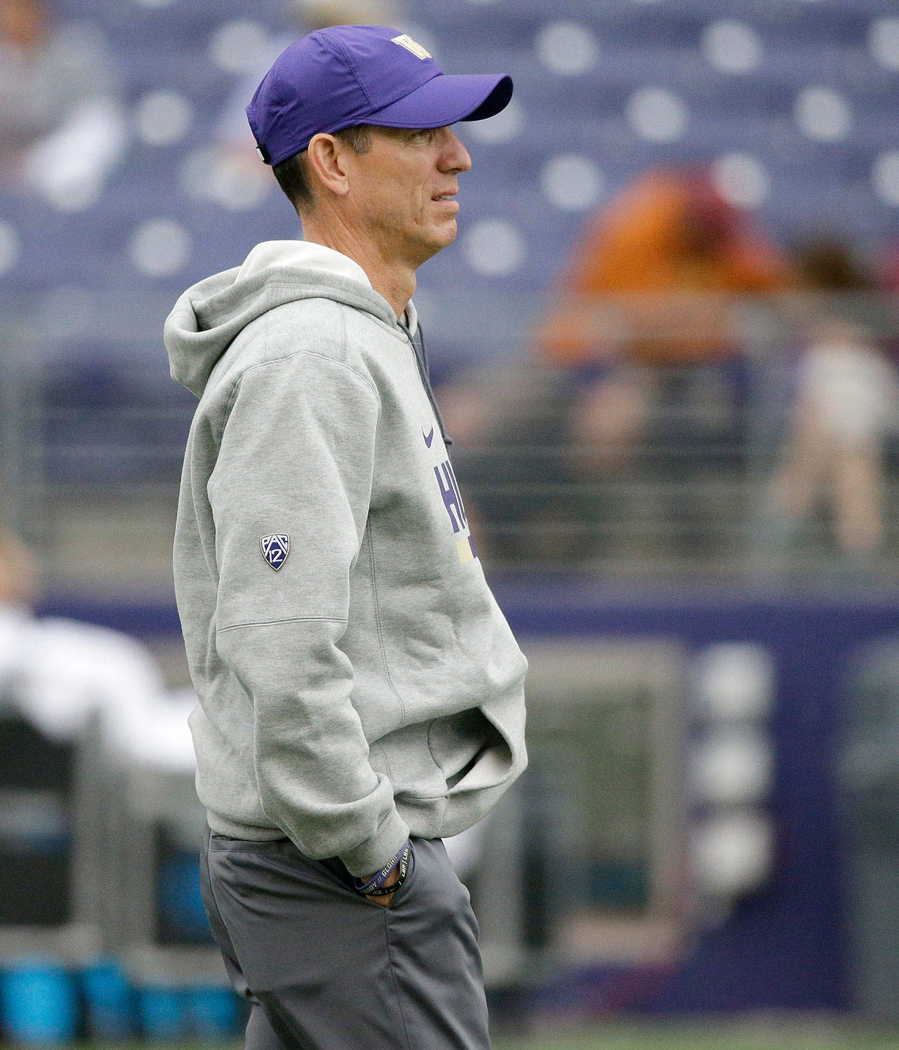 Washington assistant football coach Bob Gregory stands on the field before UW’s victory over Montana on Sept. 9 in Seattle. Gregory has taken less money and prestige to stay with his good friend Chris Petersen. (AP Photo/Ted S. Warren)