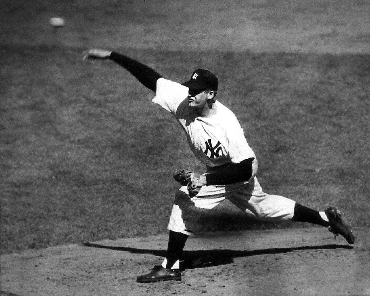 Don Larsen fires a pitch en route to the only perfect game in a World Series to date as the New York Yankees beat the Brooklyn Dodgers in Game 5, 2-0, on Oct. 8, 1956. (Associated Press)