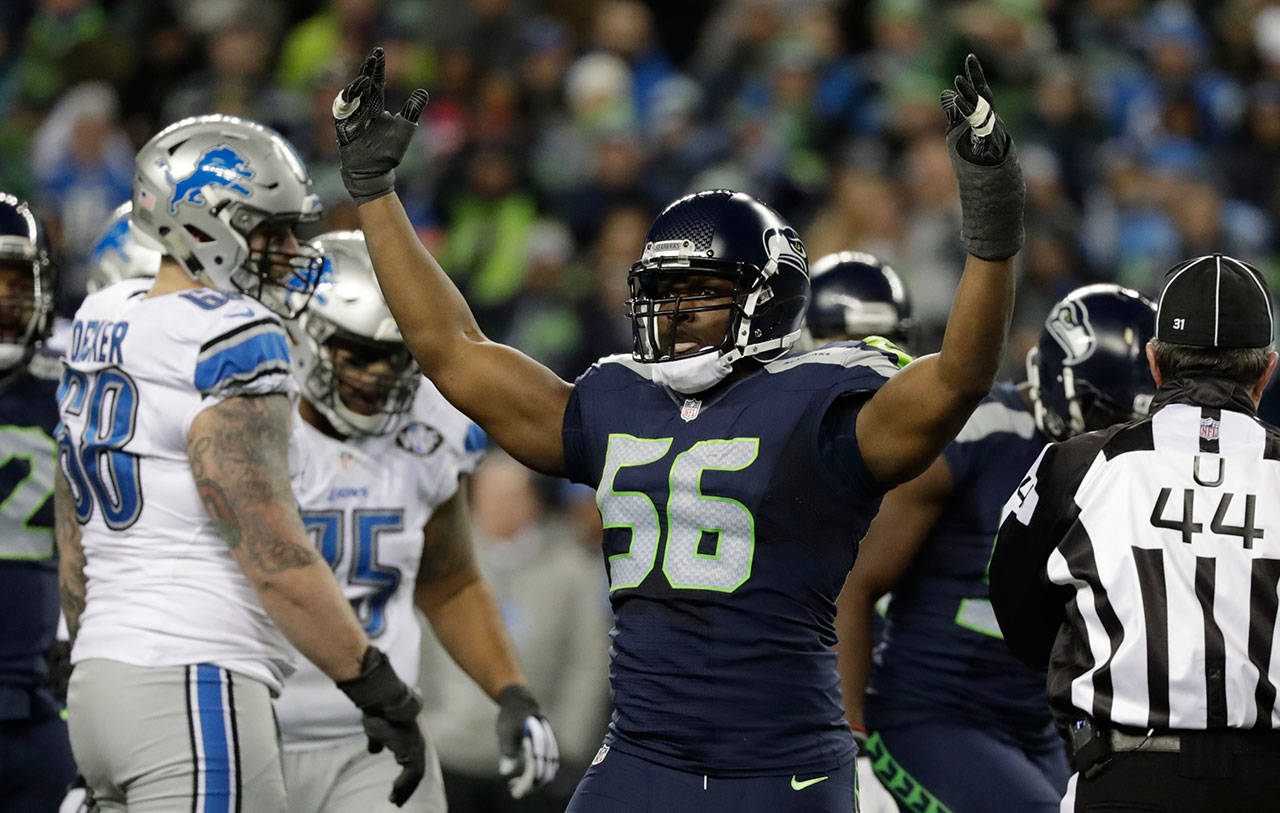 Seahawks defensive end Cliff Avril reacts to a play against the Lions in the second half of an NFC playoff game on Jan. 7, 2017, in Seattle. The Seahawks beat the Lions 26-6. (AP Photo/Elaine Thompson)