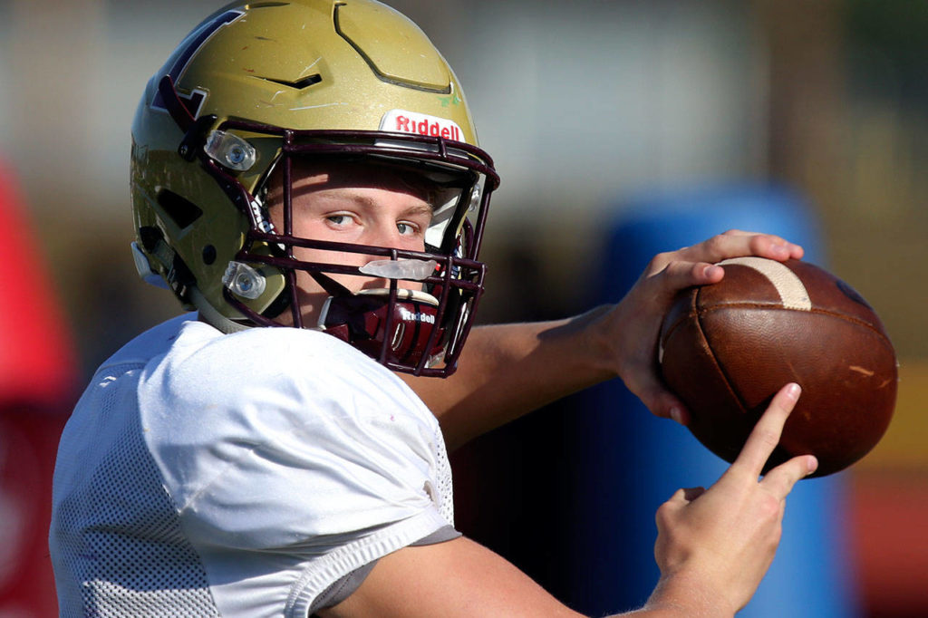 Lakewood quarterback Austin Lane throws a pass during practice on Oct. 4, 2017, at Lakewood High School in Arlington. (Kevin Clark / The Herald)
