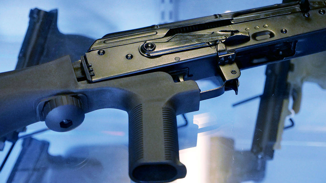 A device called a “bump stock,” attached to a semi-automatic rifle at the Gun Vault store and shooting range in South Jordan, Utah. (AP Photo/Rick Bowmer)