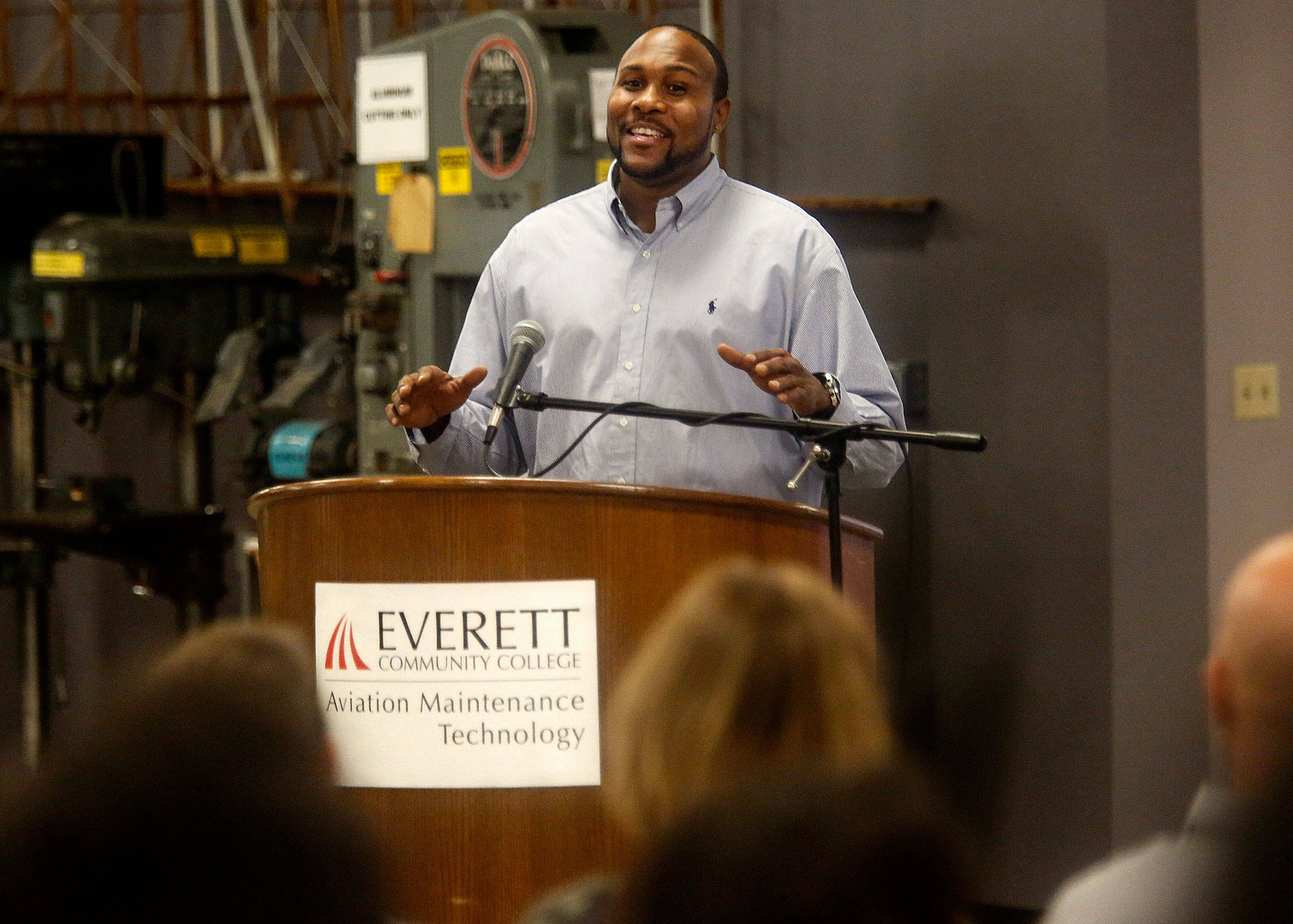 Dremond Stidwell, 44, delivers a speech during the EvCC Aviation Maintenance Technology School’s 50-year anniversay celebration Wednesday at Paine Field. Stidwell, who moved here from Atlanta for this opportunity, is a full-time student in the program and is already working in the industry. (Dan Bates / The Herald)
