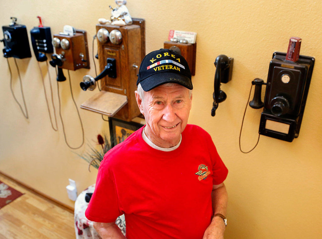 If his condo walls could speak, it wouldn’t take long to learn what line of work Gerald Rogers took up back home following the Korean War. (Dan Bates / The Herald)
