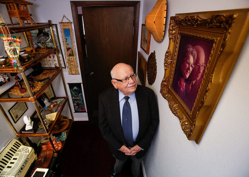 Pastor, Newton Waldrop visits a small room filled with memories such as the ornately framed photograph at right of his mother and father, Gladys and William Waldrop. (Dan Bates / The Herald)
