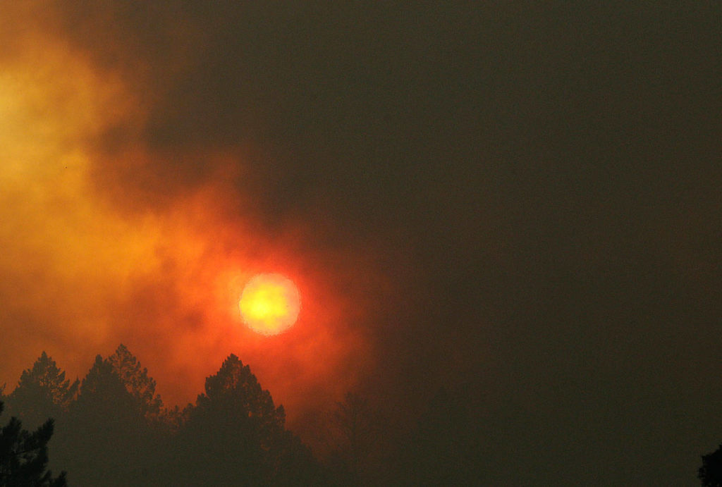 The sun shines through smoke and haze from wildfires over Santa Rosa, California, on Tuesday. (AP Photo/Jeff Chiu)

