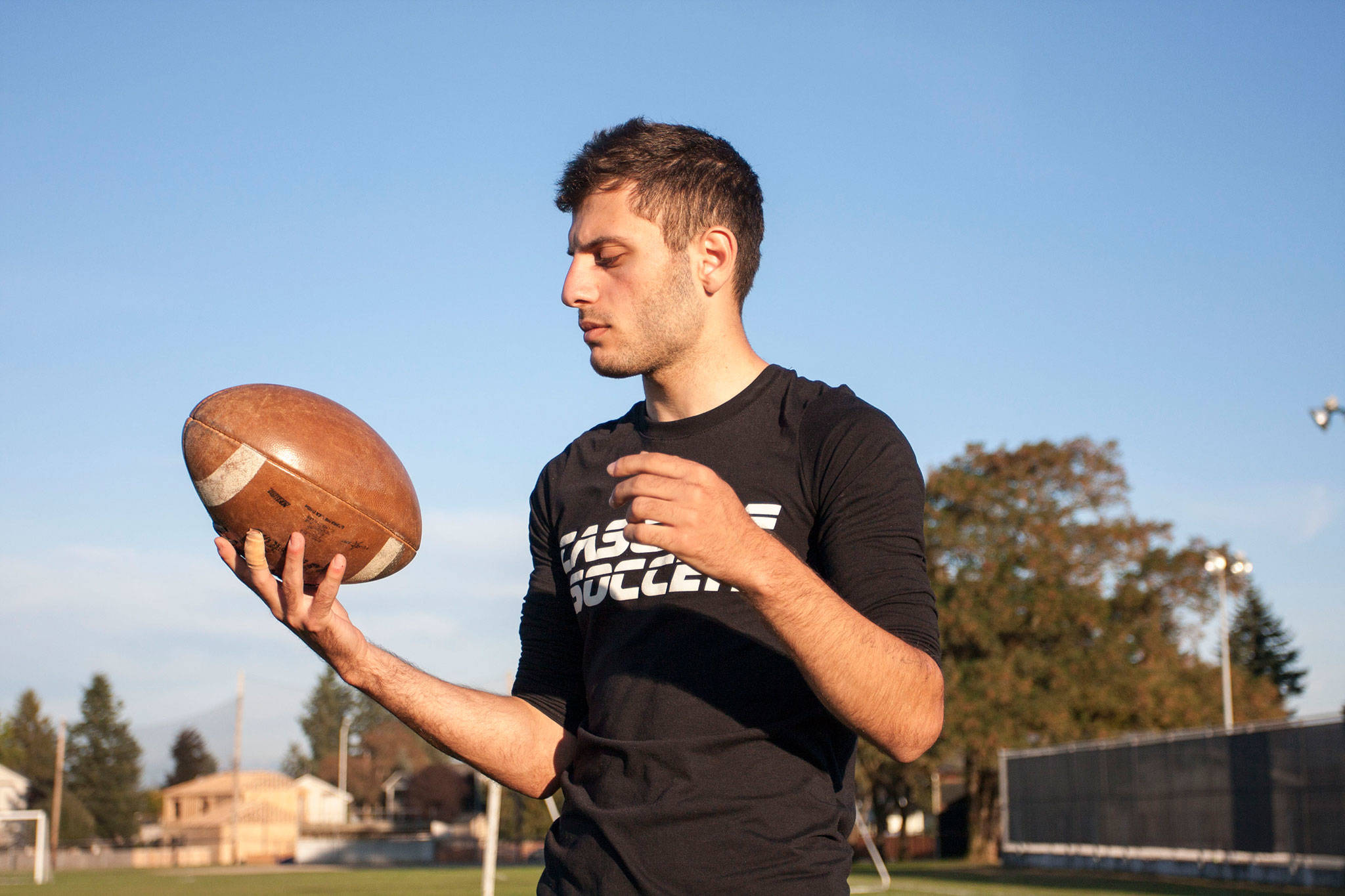 Cascade senior kicker Sarmad Aqrawi credits football and soccer with helping him assimilate to a new school and country. (Andrew Lang / The Herald)