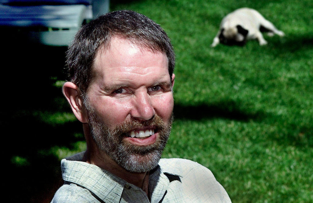 Mark Reiman, of Everett, enjoys a summer day with his buddy, Murphy. Reiman, who died in 2003, had suffered from Lou Gehrig’s disease for more than a decade. (File photo)

