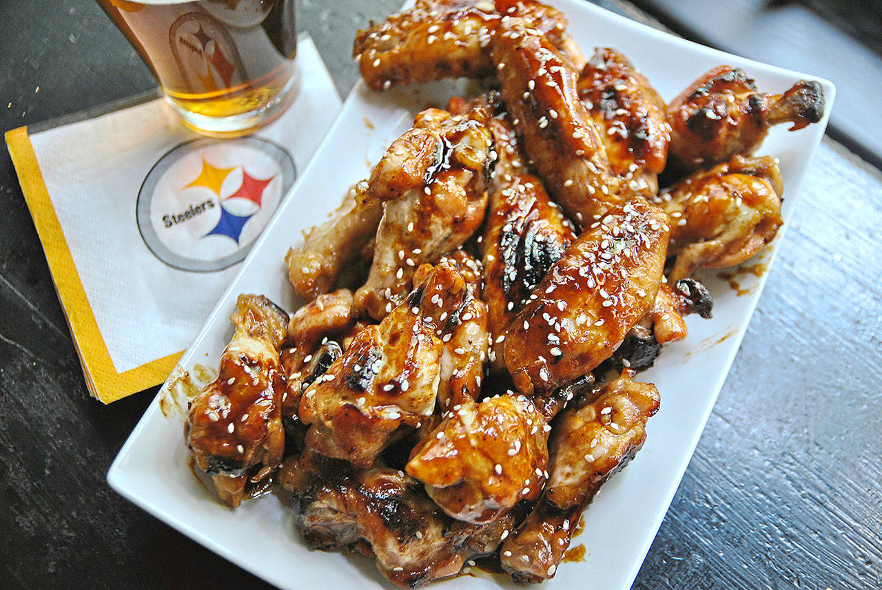 Like chicken wings with your football? Make these honey Sriracha wings with sesame seeds for the next game. (Gretchen McKay/Pittsburgh Post-Gazette)