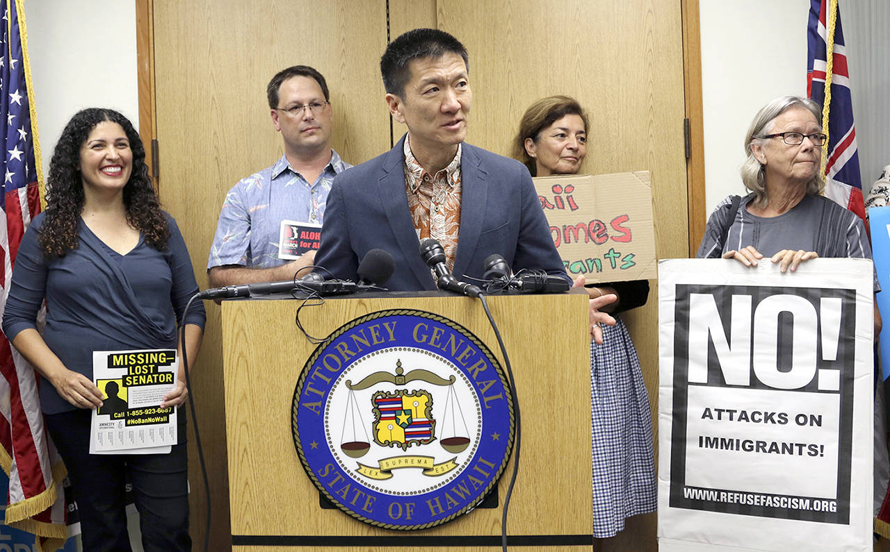 In this June 30 photo, Hawaii Attorney General Douglas Chin speaks at a news conference in Honolulu about President Donald Donald Trump’s travel ban. (AP Photo/Caleb Jones, File)
