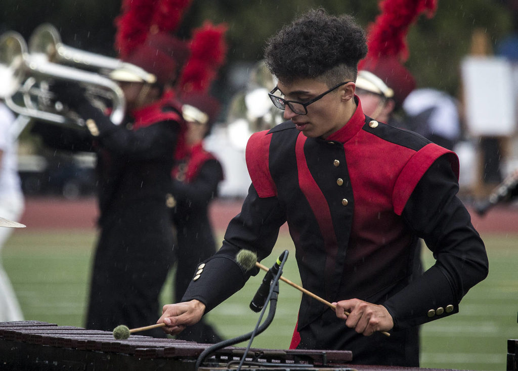 Adonis Del Valle plays marimba during a performance by Cascade’s marching band at the Puget Sound Festival of Bands at Everett Memorial Stadium on Saturday, Oct. 21. (Ian Terry / The Herald)
