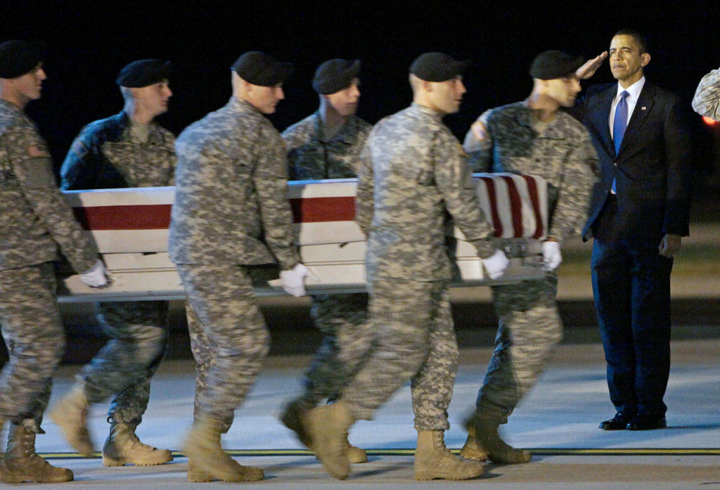 President Barack Obama salutes as an Army team carries the case containing the remains of Sgt. Dale R. Griffin of Terre Haute, Indiana, at Dover Air Force Base in Delaware in 2009. President Donald Trump has claimed his predecessors did not sufficiently honor the nation’s fallen. (AP Photo/Pablo Martinez Monsivais, File)
