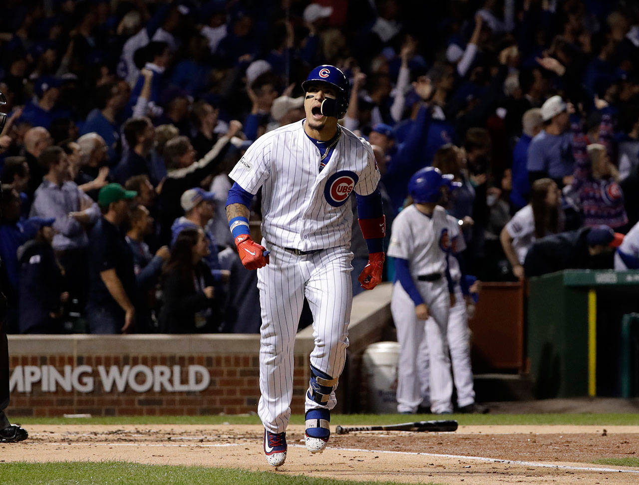 The Cubs’ Javier Baez reacts after hitting a home run during the second inning against the Dodgers in Game 4 of the National League Championship Series on Oct. 18, 2017, in Chicago. (AP Photo/Matt Slocum)
