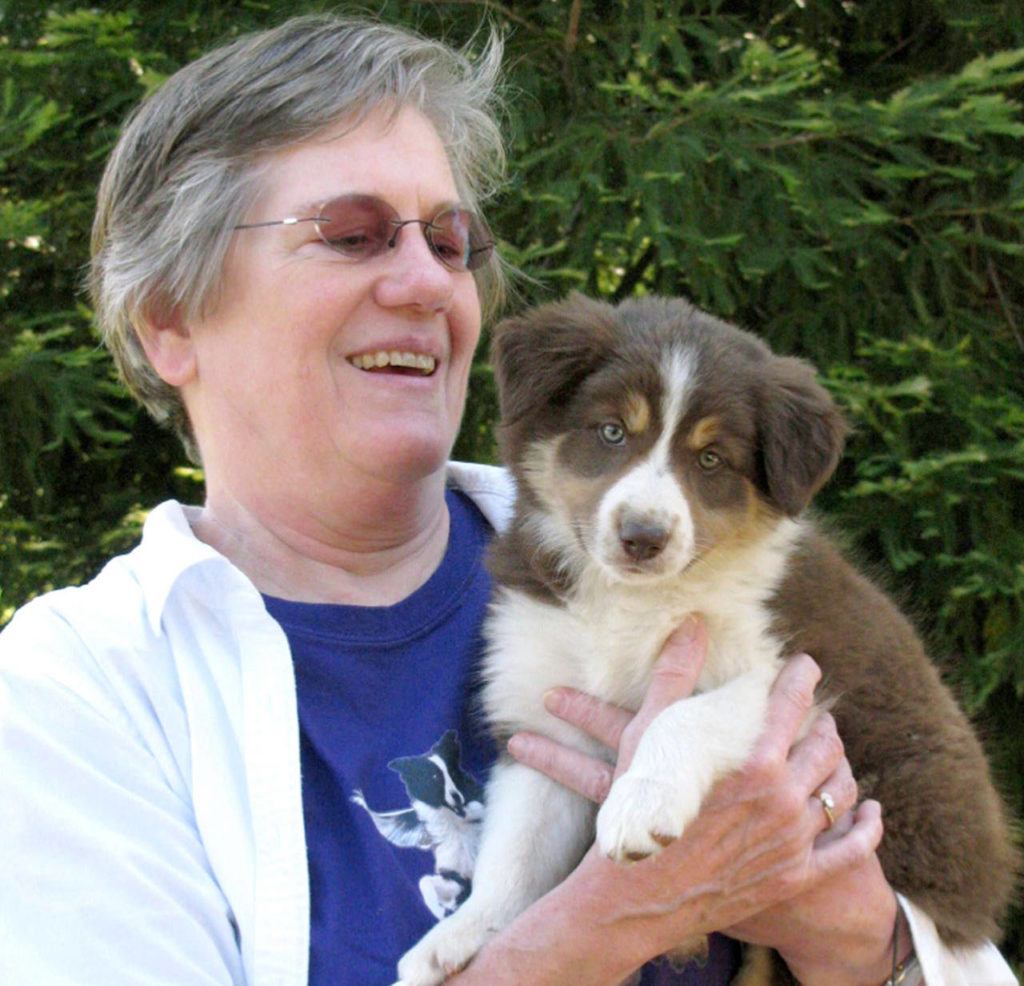 In this 2012 photo, Lynne Powell picks up her border collie Jemma from the breeder in Grants Pass, Oregon. Lynne’s car had gone off the road and into a ravine in the heavy smoke from a wildfire in California. After searching for her all night and the next day, a detective called to tell her husband, George Powell, that Lynne’s body was found near her car. (George Powell via AP, File)
