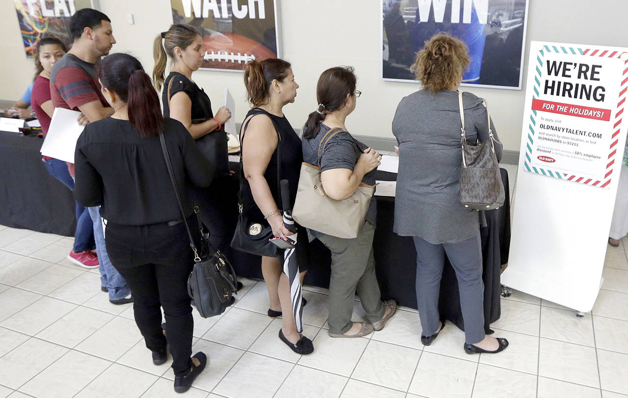 In this Oct. 3 photo, job seekers wait in line at a job fair at the Dolphin Mall in Sweetwater, Florida. (AP Photo/Alan Diaz)