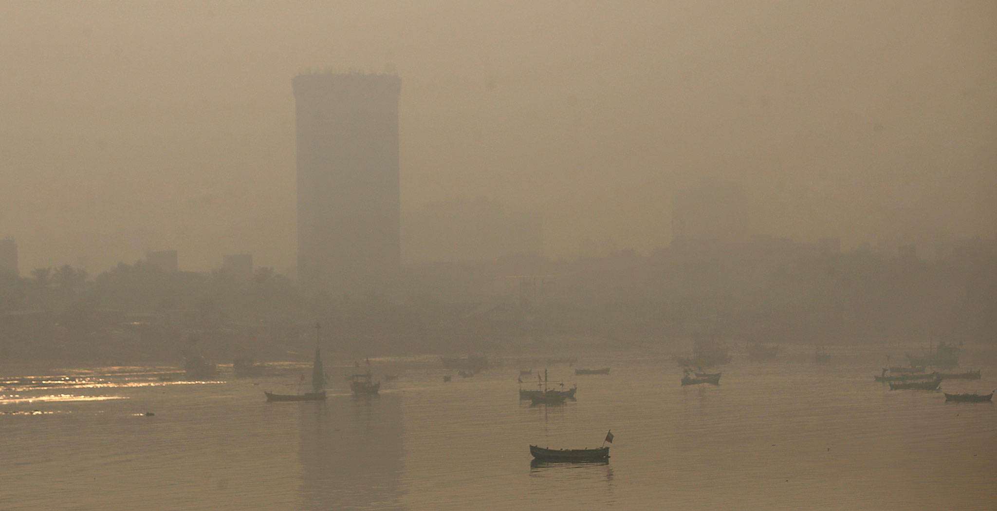Morning smog envelops the skyline in Mumbai, India, on Friday. (AP Photo/Rafiq Maqbool)
