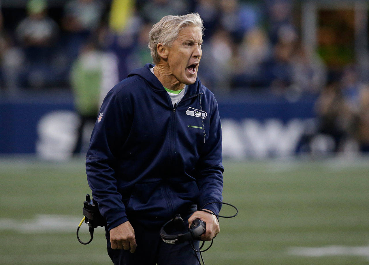 Seahawks head coach Pete Carroll protests a first down ruling during the second quarter of a game against the Colts on Oct. 1, 2017, in Seattle. (AP Photo/Elaine Thompson)